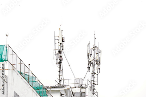 communication tower with antennas on the top of building isolate on white background