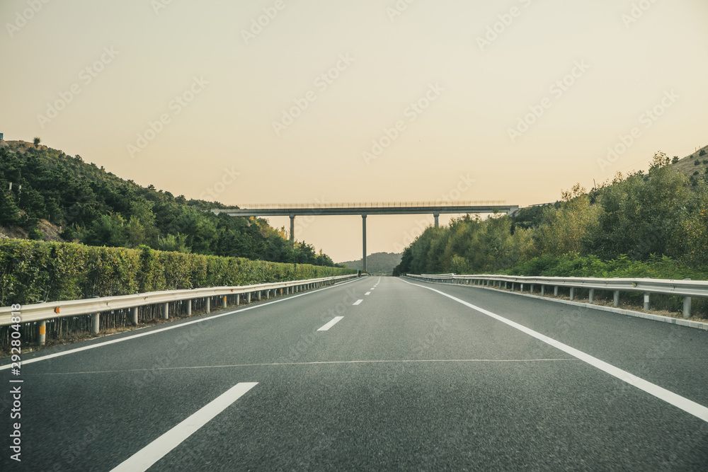 Fototapeta premium Curved country road in autumn