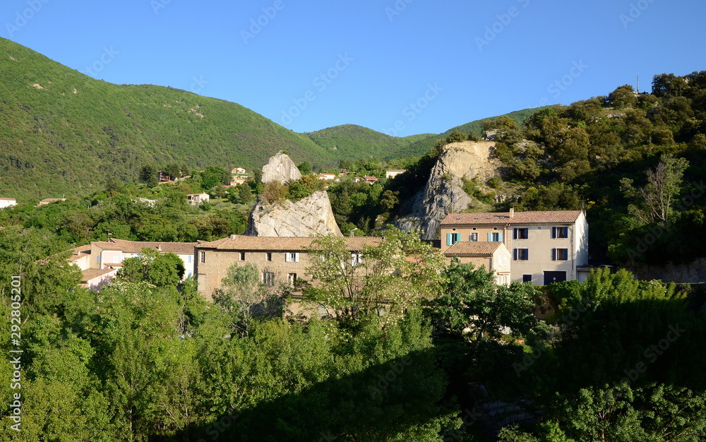 Panoramic view on old stone buildings of Nyons. Nyons is a small beautiful village in Provence, Drome, France. It is well-known by its Roman bridge crossing the river.