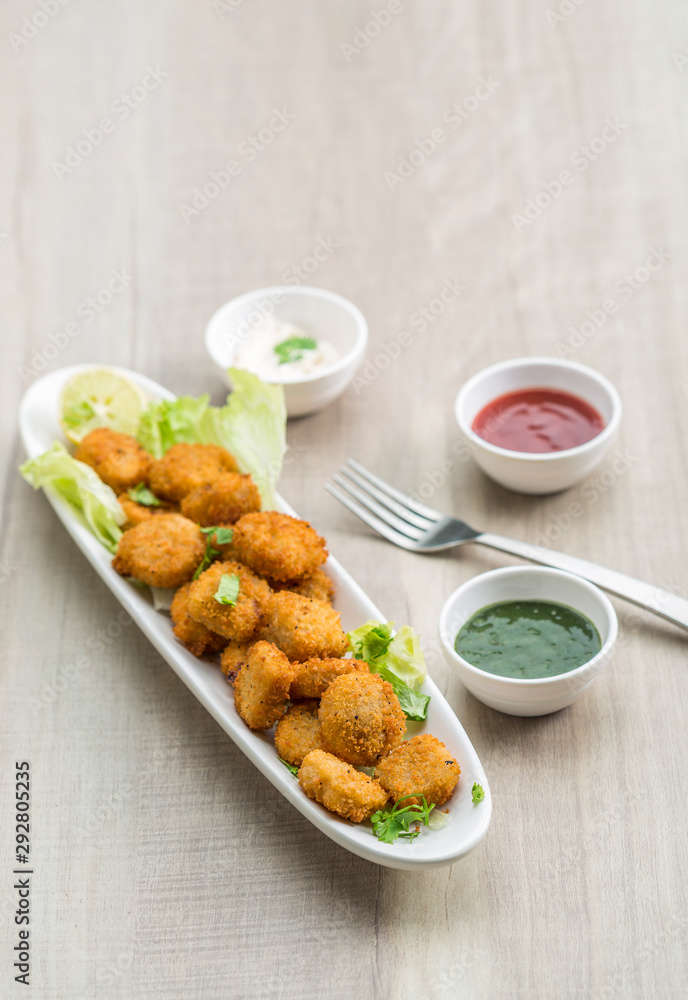 Button cutlets with sauce and green chutney Button cutlets with sauce and green chutney