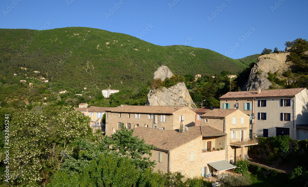 Panoramic view on old stone buildings of Nyons. Nyons is a small beautiful village in Provence, Drome, France. It is well-known by its Roman bridge crossing the river.