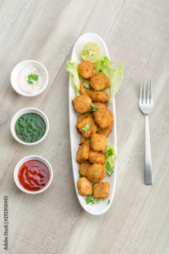 Button cutlets with sauce and green chutney