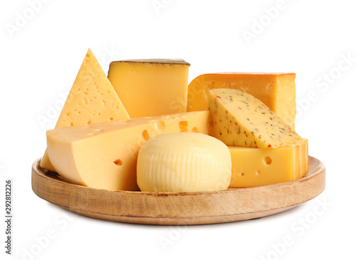 Wooden plate with different kinds of cheese on white background photo