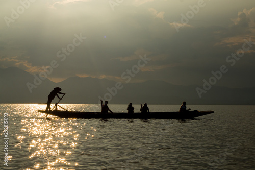 sunset on the lake, boat silhouette © kritsada