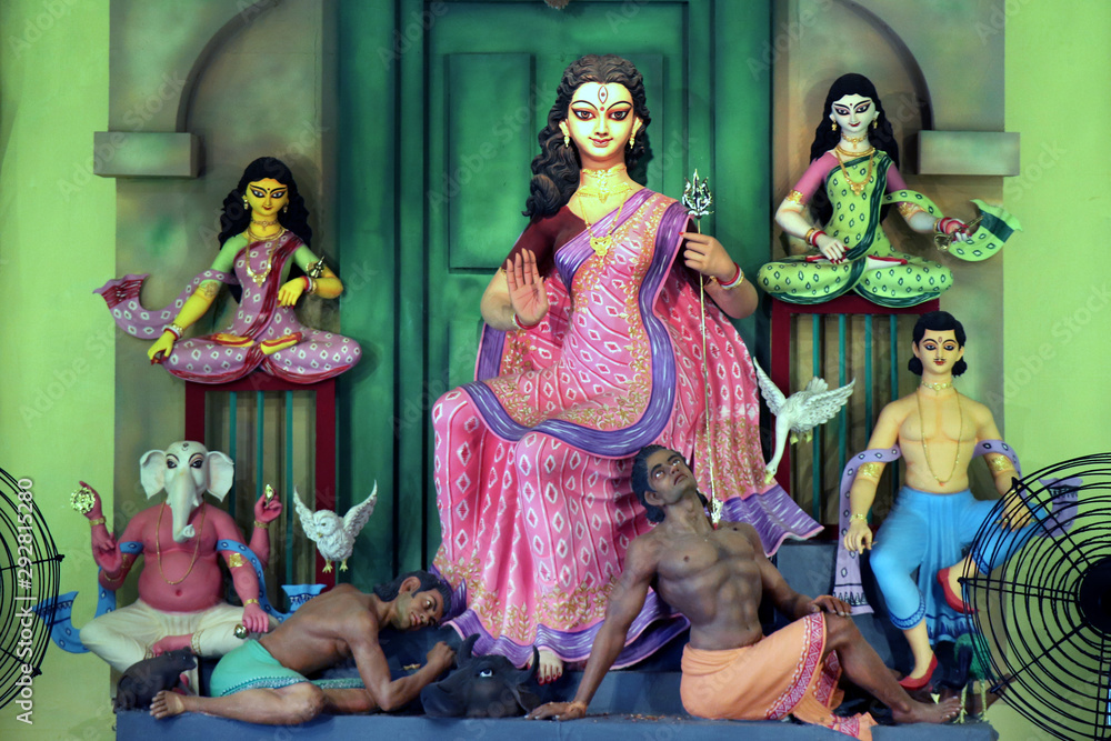 A close up view of a Durga idol. According to the Indian Mythology a decorated clay Sculptures of ten handed goddess Durga during the annual autumnal Durga Puja (worship) festival of India.