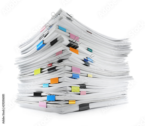 Stack of documents with colorful binder clips on white background photo