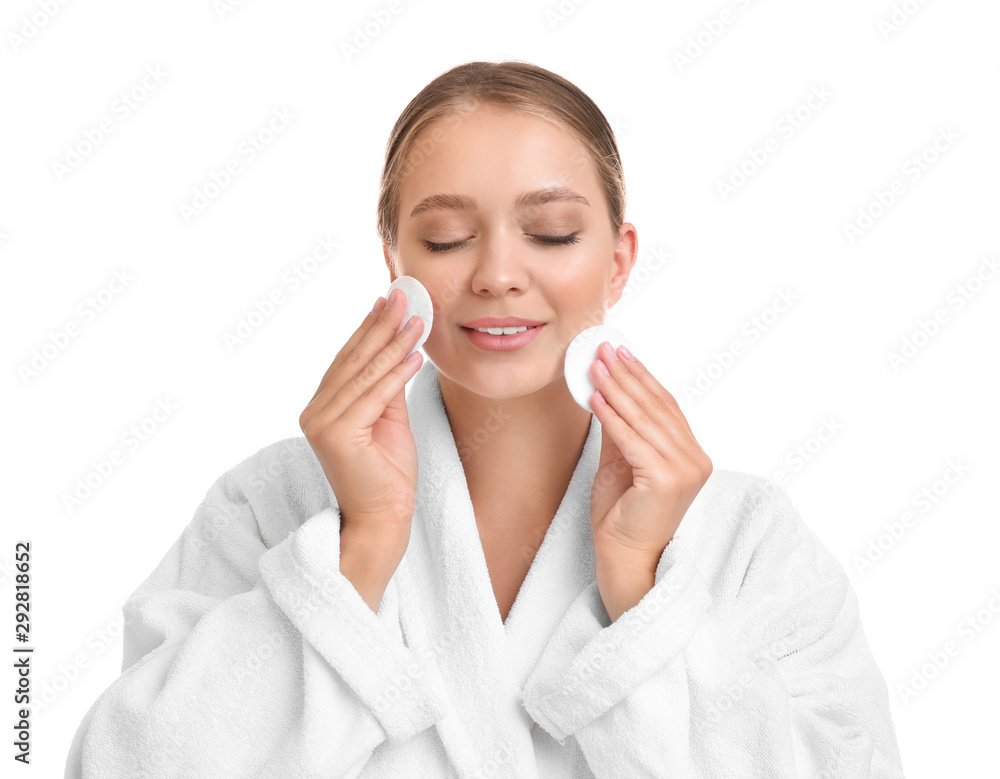 Beautiful young woman with cotton pads on white background