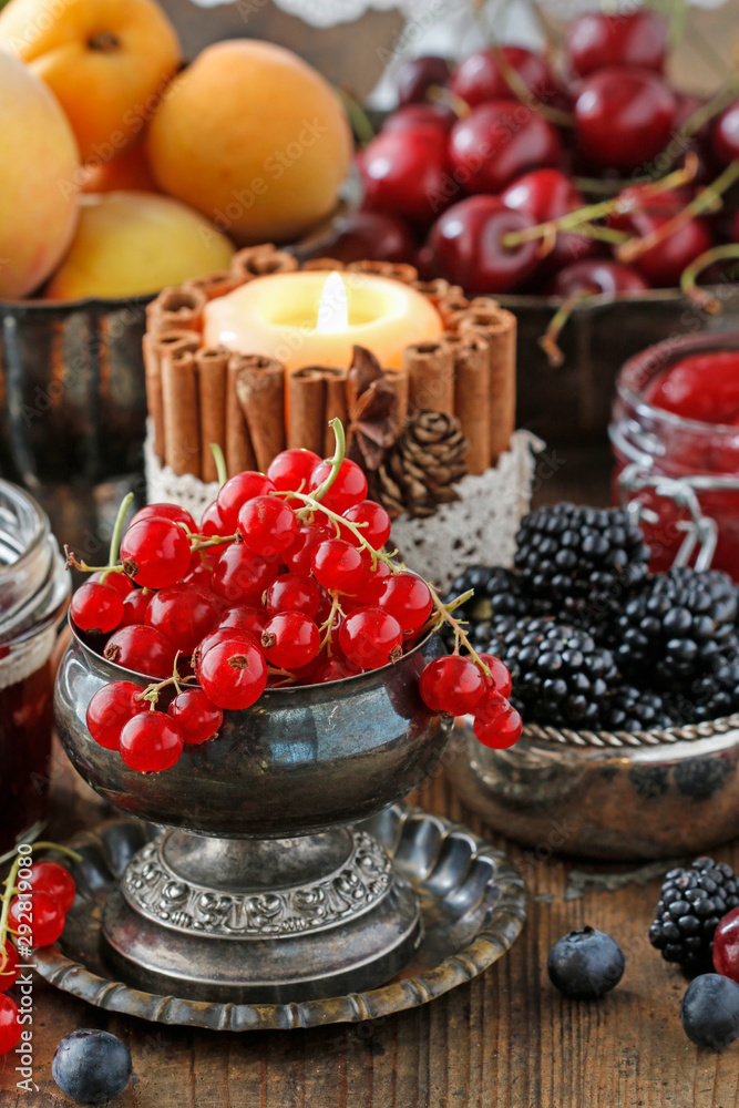 Redcurrant (ribes rubrum) fruit in old silver bowl.