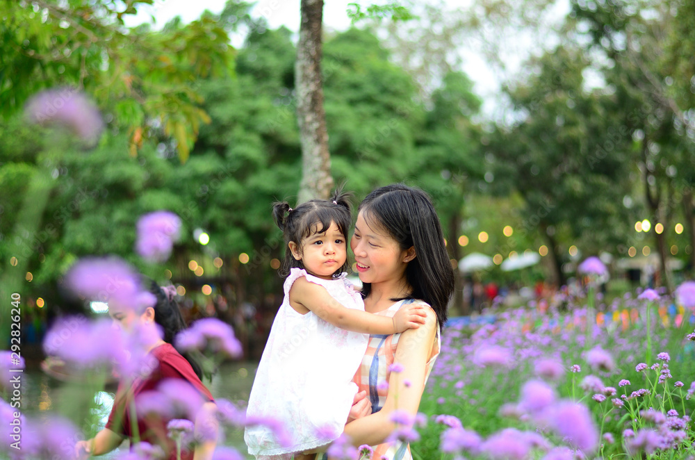 Little Child Girl and Mother at The Public Park Little Child Girl and Mother at The Public Park