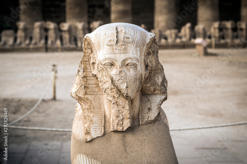 Ancient pharaoh head statue at the entrance hall of the Karnak Temple Complex, El-Karnak, Luxor Governorate, Egypt