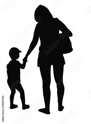 Silhouette of mother with kid walking