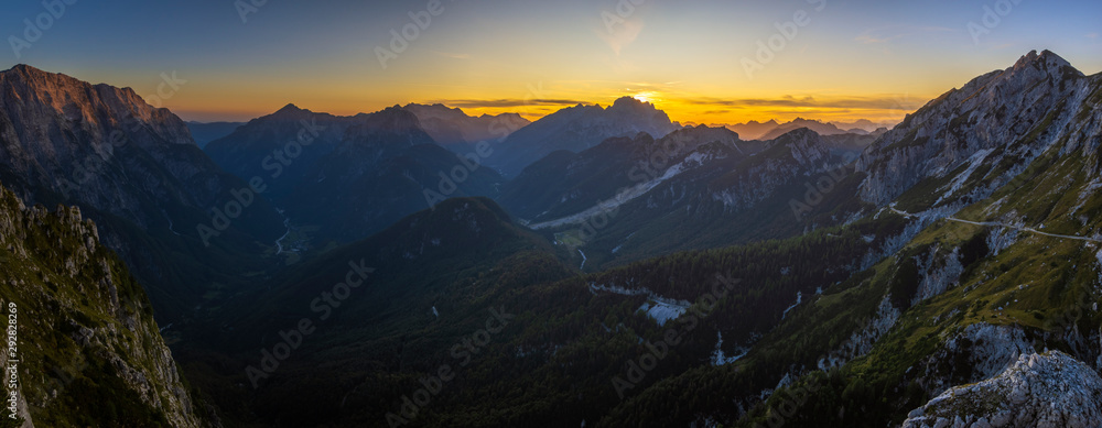 Naklejka Panorama of the Julian Alps at sunset from the Mangart peak, the Triglav peak visible in the central part of the frame