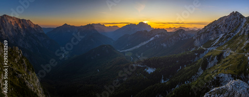 Panorama of the Julian Alps at sunset from the Mangart peak, the Triglav peak visible in the central part of the frame