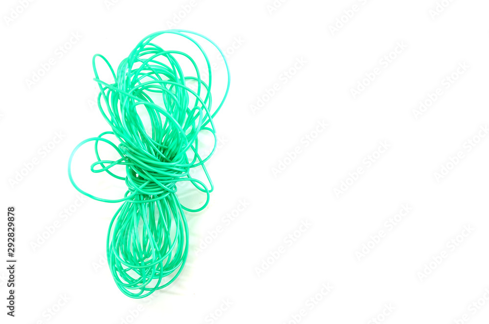 green, plastic cord on a white background. 