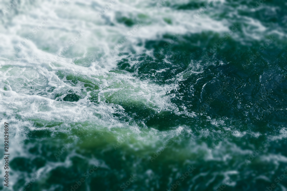 Fototapeta premium Blue and turquoise water with irregular wave structure