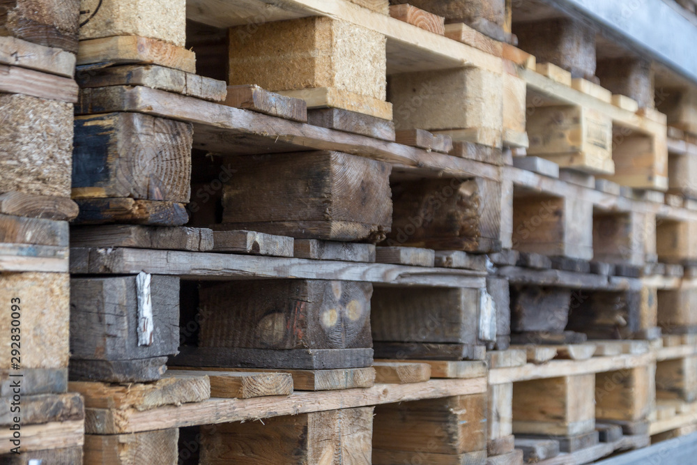 Close up of wooden cargo pallets overlap in warehouse. Selectiive focus. Close up of wooden cargo pallets overlap in warehouse. Selectiive focus.