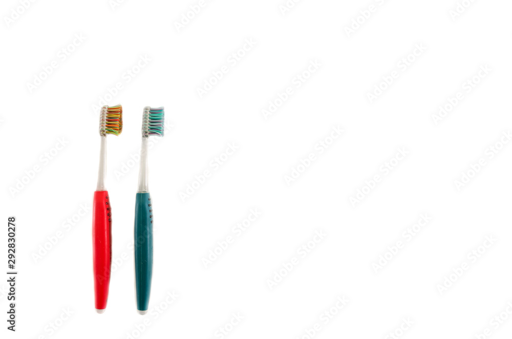 green and red toothbrushes isolated on a white background. green and red toothbrushes isolated on a white background.