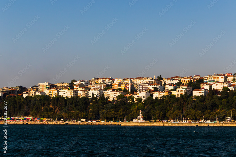 distant view of buildings in Istanbul through the Bosporus or Bosphorus strait on a bright day