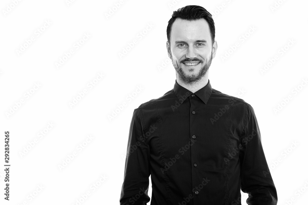 Studio shot of happy young man smiling Studio shot of happy young man smiling