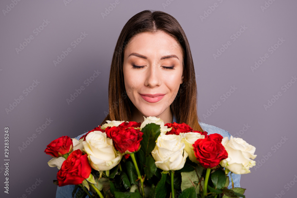Wonderful roses from my boyfriend. Close up photo of peaceful calm positive lady hold bunch of flowers roses smell enjoy scent wear denim jeans clothes shirt isolated over grey color background Wonderful roses from my boyfriend. Close up photo of peaceful calm positive lady hold bunch of flowers roses smell enjoy scent wear denim jeans clothes shirt isolated over grey color background