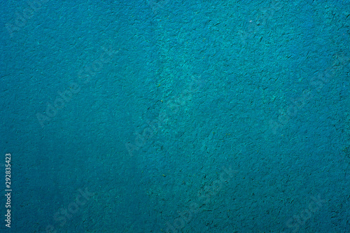 Blue painted wooden surface with a rough texture