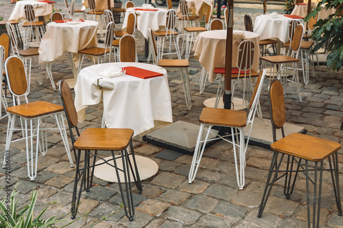 patio cafe exterior furniture environment in paved stone old European street 