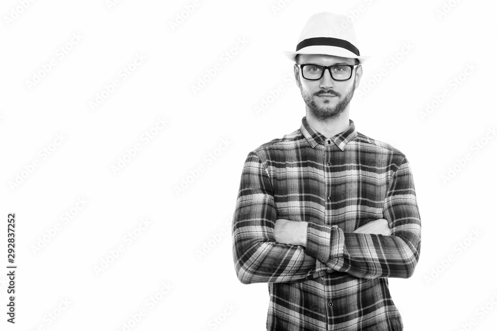Studio shot of young man with arms crossed Studio shot of young man with arms crossed