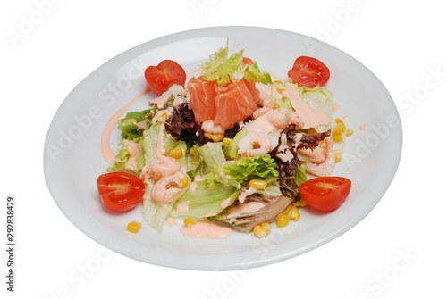 Vegetable seafood salad in plate on a white isolated background