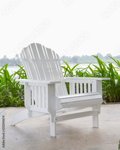 The white wood beach chair in the backyard
