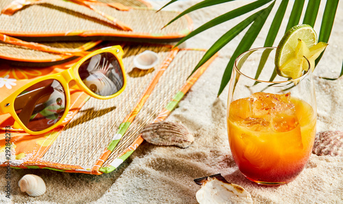 Fototapeta Naklejka Na Ścianę i Meble -  Rum orange cocktail on a tropical beach