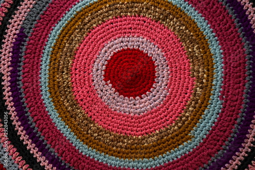 Background, texture old multicolored Oriental rug. Top view. Concept needlework, knitting, weaving