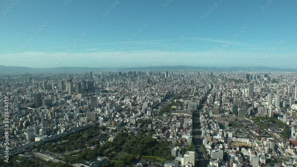 OSAKA, JAPAN - CIRCA SEPTEMBER 2019 : Aerial high angle view of CITYSCAPE of OSAKA in daytime. Osaka is the capital city of Osaka Prefecture and the second largest metropolitan area in Japan. OSAKA, JAPAN - CIRCA SEPTEMBER 2019 : Aerial high angle view of CITYSCAPE of OSAKA in daytime. Osaka is the capital city of Osaka Prefecture and the second largest metropolitan area in Japan.