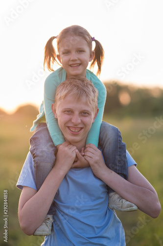 Brother and younger sister in the field