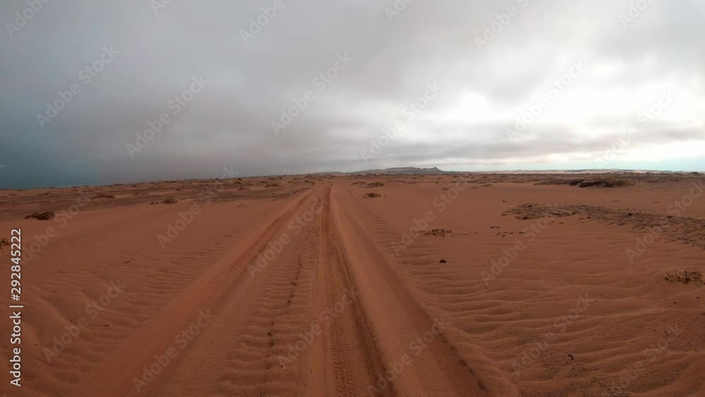 FPV of dune riding and 4x4 driving in sand dunes and on the beach. Shot in the Namibian Skeleton Coast, part of the Namib Desert FPV of dune riding and 4x4 driving in sand dunes and on the beach. Shot in the Namibian Skeleton Coast, part of the Namib Desert