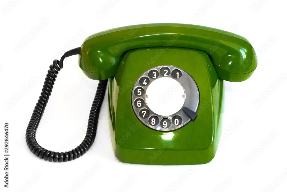 Old green rotary telephone on a white background Old green rotary telephone on a white background