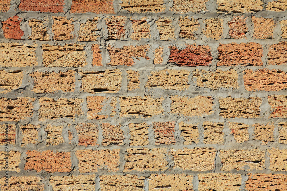 The shell rock brick wall, texture. The fragment of a new bricklaying. The construction of a new privat building. Ecological house