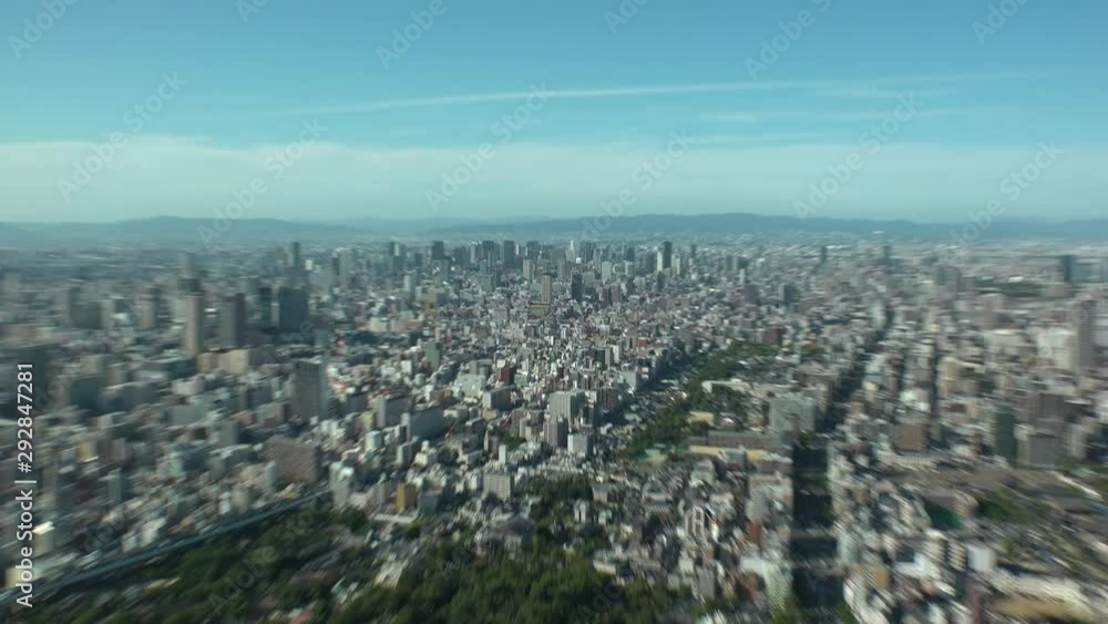OSAKA, JAPAN - CIRCA SEPTEMBER 2019 : Aerial high angle view of CITYSCAPE of OSAKA in daytime. Osaka is the second largest metropolitan area in Japan. Zoom in shot. OSAKA, JAPAN - CIRCA SEPTEMBER 2019 : Aerial high angle view of CITYSCAPE of OSAKA in daytime. Osaka is the second largest metropolitan area in Japan. Zoom in shot.