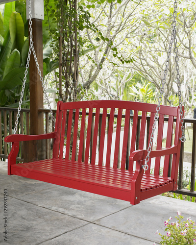 The red wood swing in the backyard.