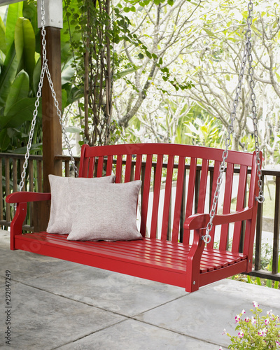 The red wood swing in the backyard.