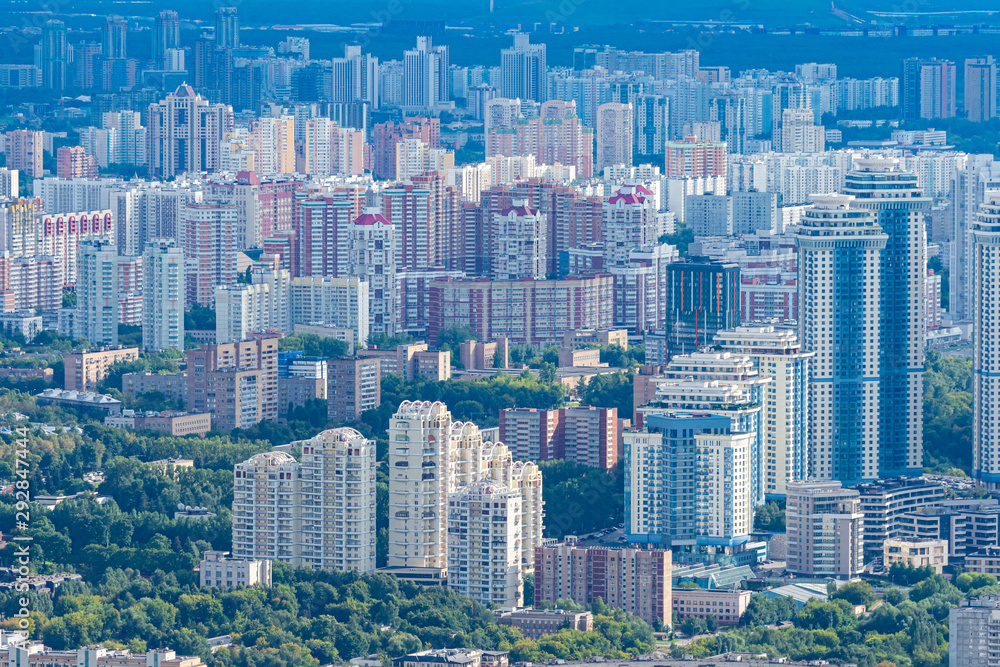 Panorama of the city from a height. Urban landscape. View of the big city. Houses and offices. Urban architecture. Residential area.