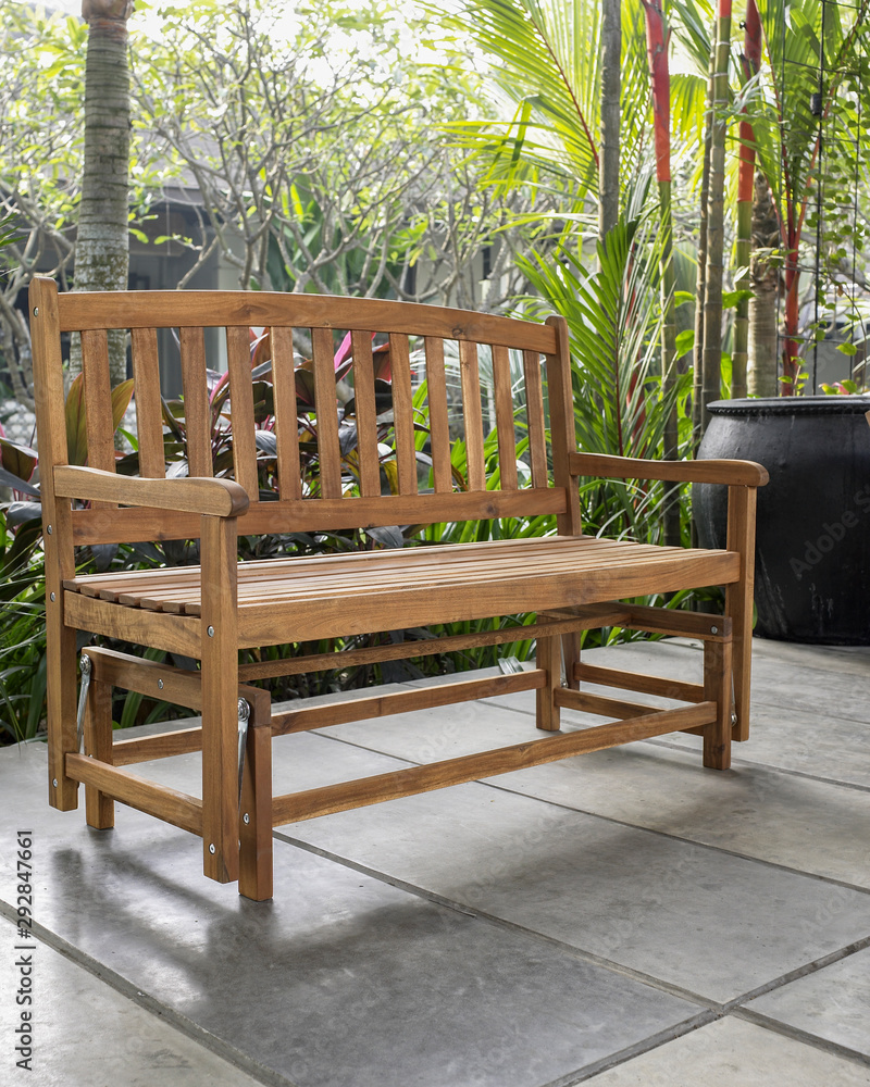 The wood bench in the backyard.