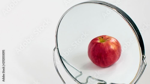 Eating Disorder, Anorexia, Bulimia, Binge Eating, Apple in Mirror, Background, Copy Space photo