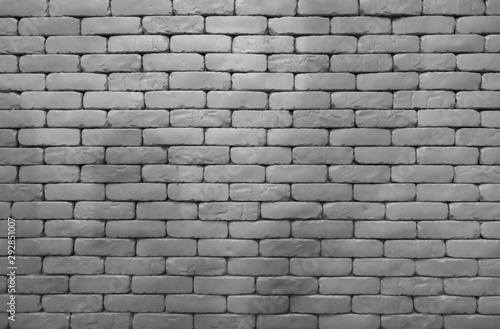 Gray brick wall texture background with space. Building interior design concept. Dead, sad, hopeless and despair background. Empty brick wall. Home interior decor concept. Full frame gray brick wall.