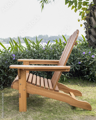The wood beach chair in the backyard.