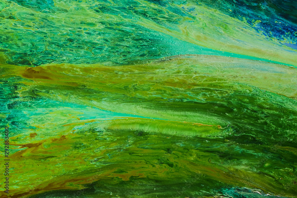 Abstract Oil color paint splatter on ground.