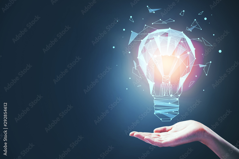 idea concept with bulb in hand - obrazy, fototapety, plakaty 