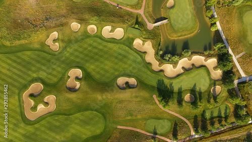 Golf course top view with players. Aerial view of golfers on putting green