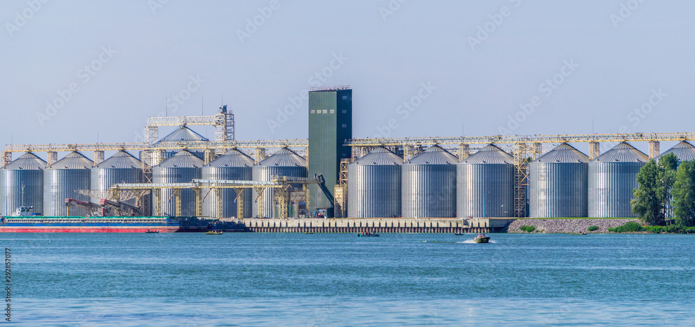 Building of a modern elevator, an agricultural granary, on the banks of the Dnieper River in Eastern Europe