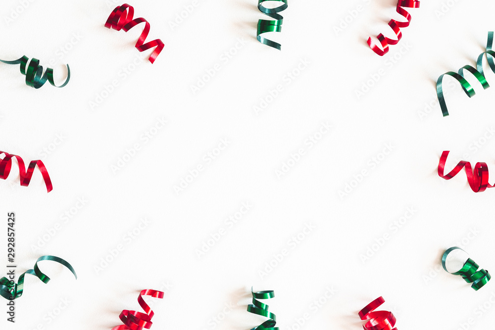 Christmas composition. Ribbon decorations on white background. Christmas, winter, new year concept. Flat lay, top view, copy space - obrazy, fototapety, plakaty 