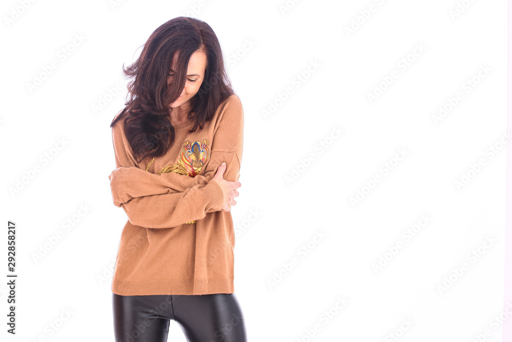 woman with sweater with beatiful hair beeing playful woman with sweater with beatiful hair beeing playful